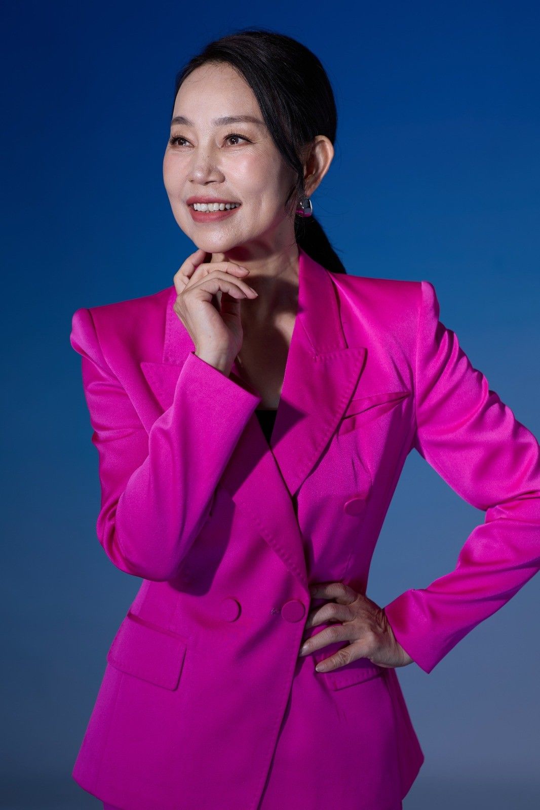 Ping Yan entrepreneur and ABS International CEO in pink blazer portrait